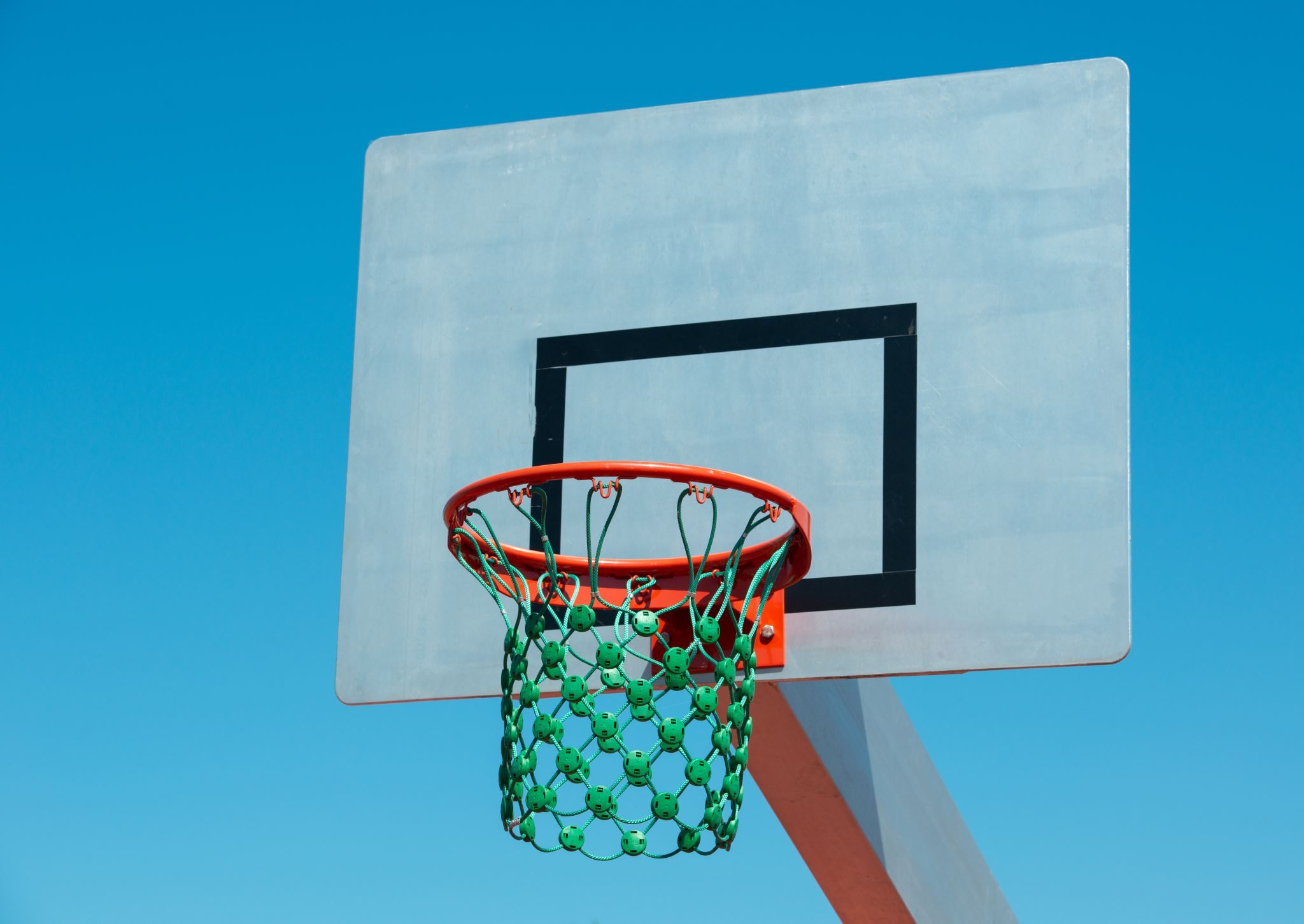 Basketball-hoop-against-blue-sky
